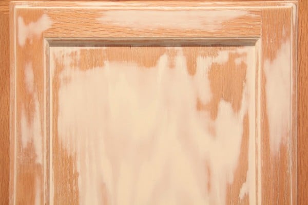 using brushing putty to cover wood grain before painting kitchen cabinets