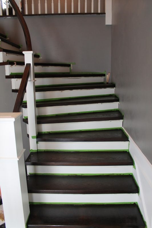 painted and stained staircase remodel in process - Construction2Style via @Remodelaholic