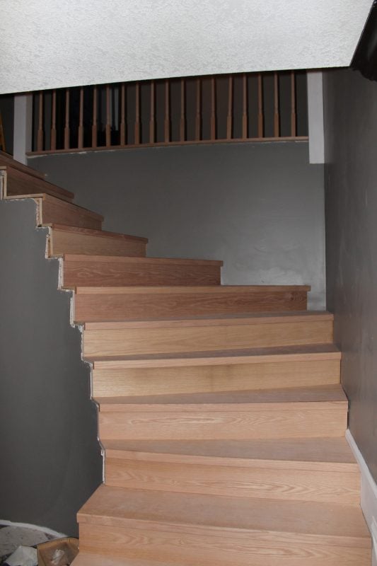 stair remodel with new wood treads - Construction2Style via @Remodelaholic