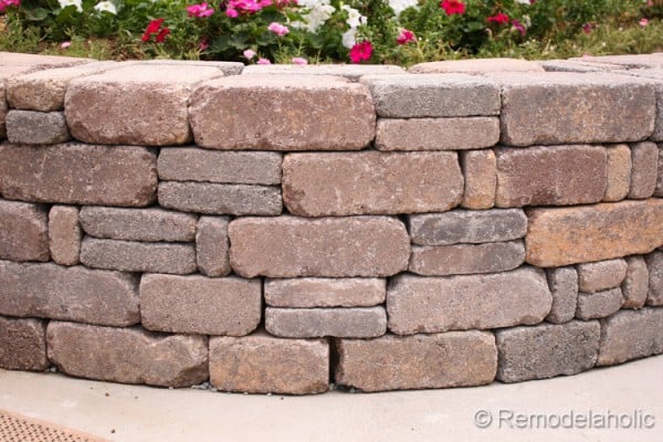 Beautiful retaining wall for a backyard garden, DIY tutorial from Remodelaholic