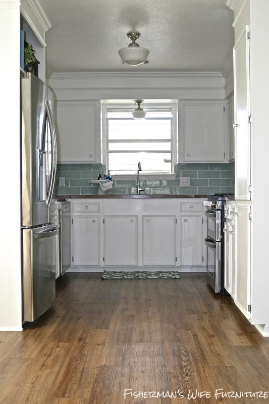 small white kitchen remodel, horsehoe kitchen floor plan, Fisherman's Wife Furniture featured on Remodelaholic.com